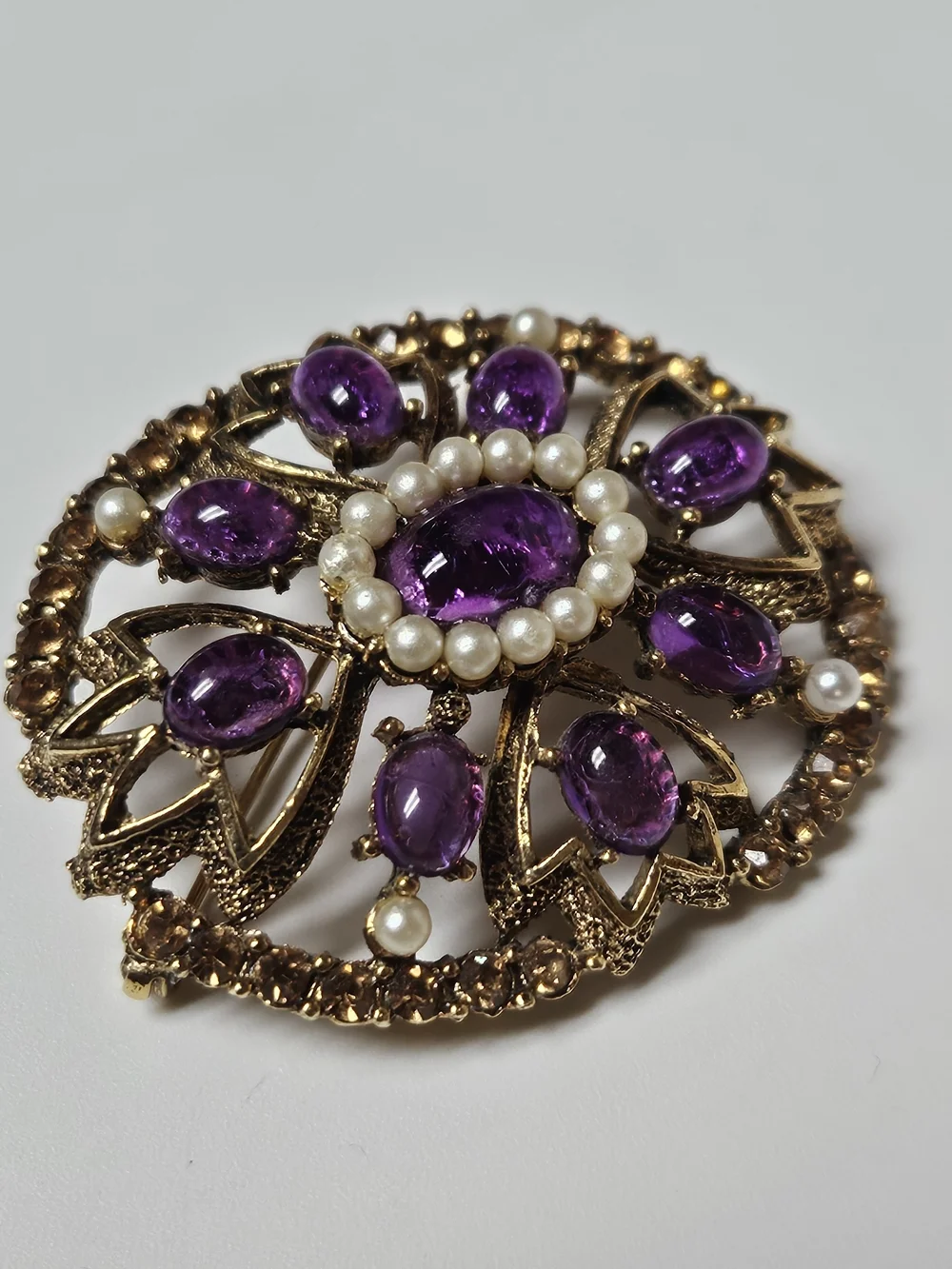 Gold-Tone Brooch with Purple Cabochons and Pearl Halo